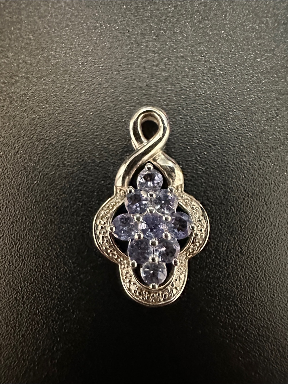 Sterling Silver Floral Pendant with Light Purple Stones